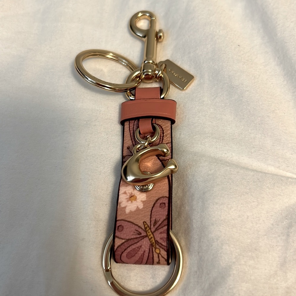 Coach butterfly trigger snap bag charm